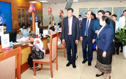 Hà Nội trao đổi kinh nghiệm chính quyền địa phương hai cấp với Lào